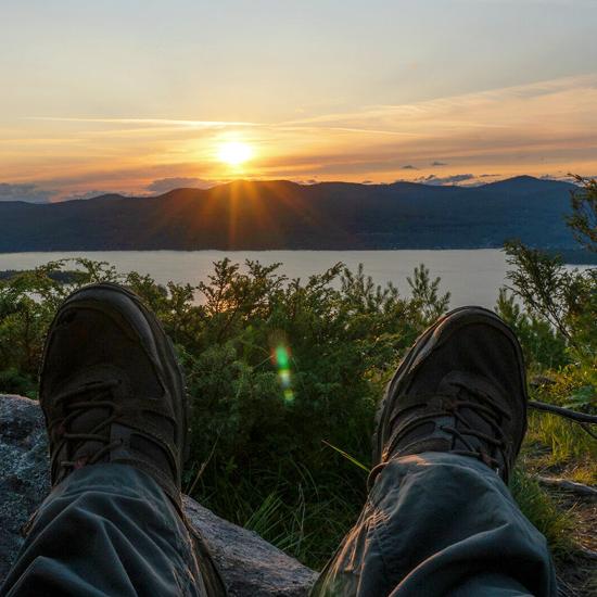 View+of+a+sunset+over+a+mountain+from+a+hiker%27s+perspective