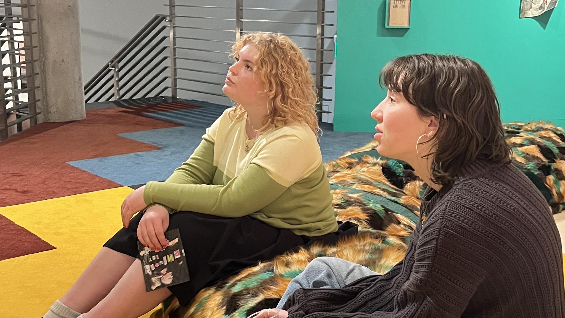 Piper Ingels '24 and Helen Branch ’24 lead a discussion in the Mezzanine Gallery.