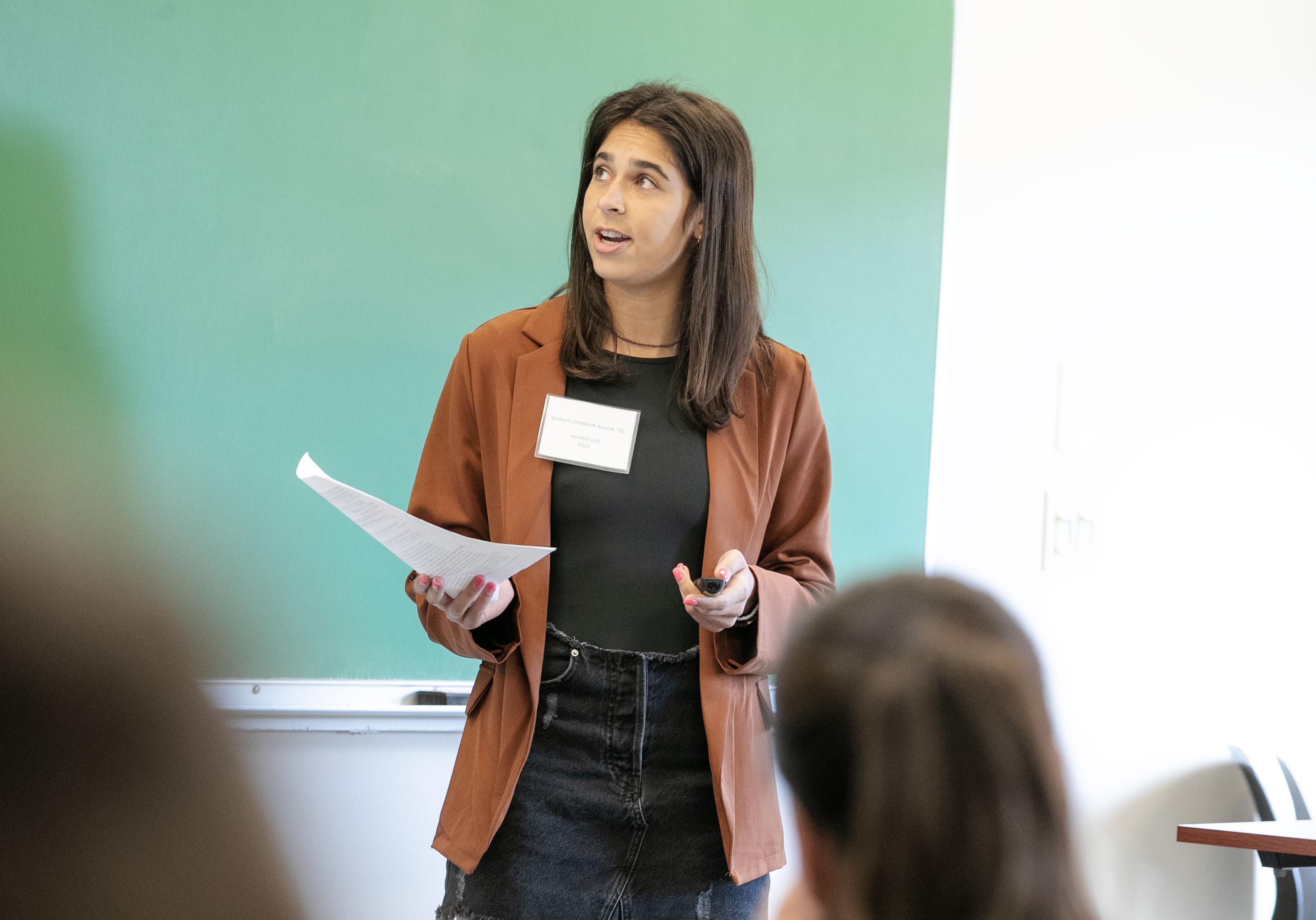 Izzy Sullivan ’24 gives a presentation about her self-determined major in broadcast journalism. 